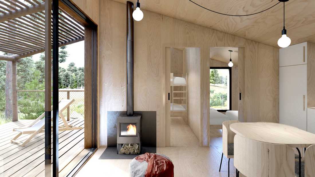 Construction d'une yakisugi house, cabane en bois en pleine nature - séjour avec cheminée